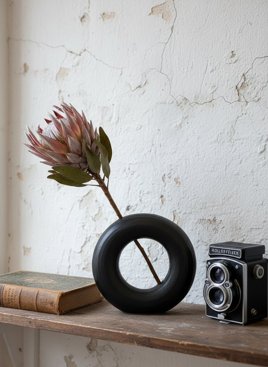 Ceramic object #54 (Black donut vase with hole)